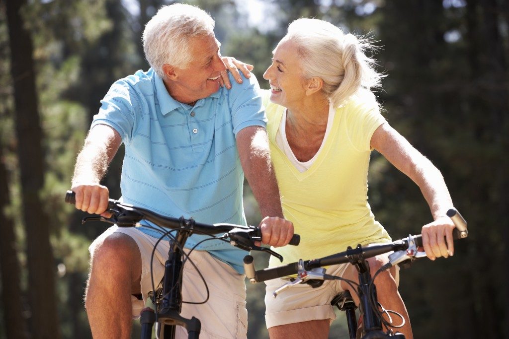 Senior couple riding a bicycle