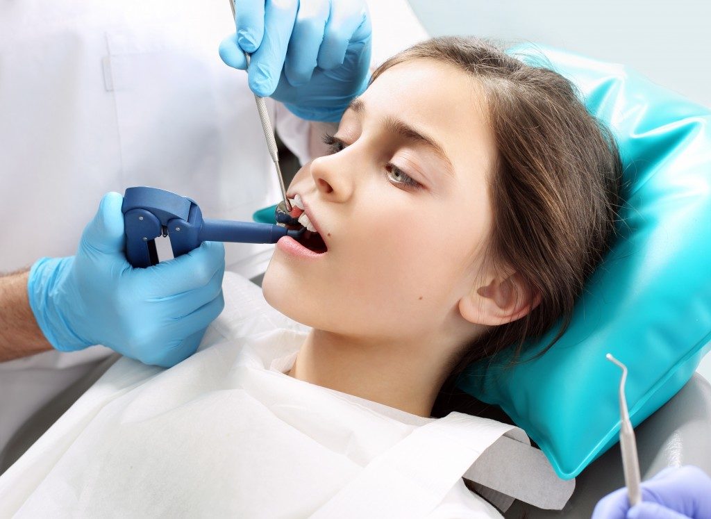 woman undergoing root canal treatment