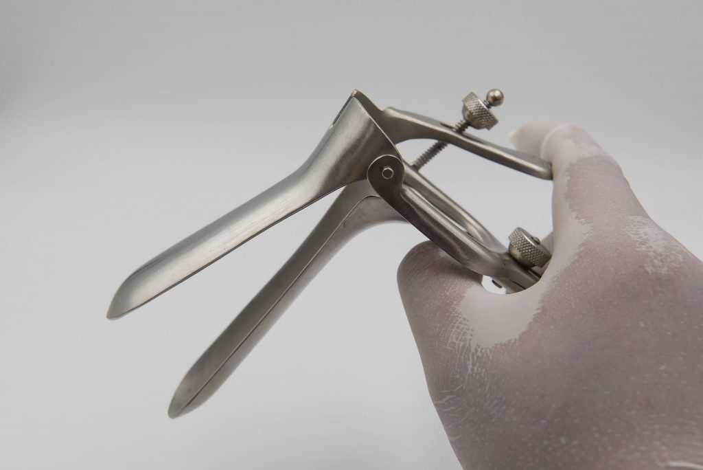 doctor holding a speculum