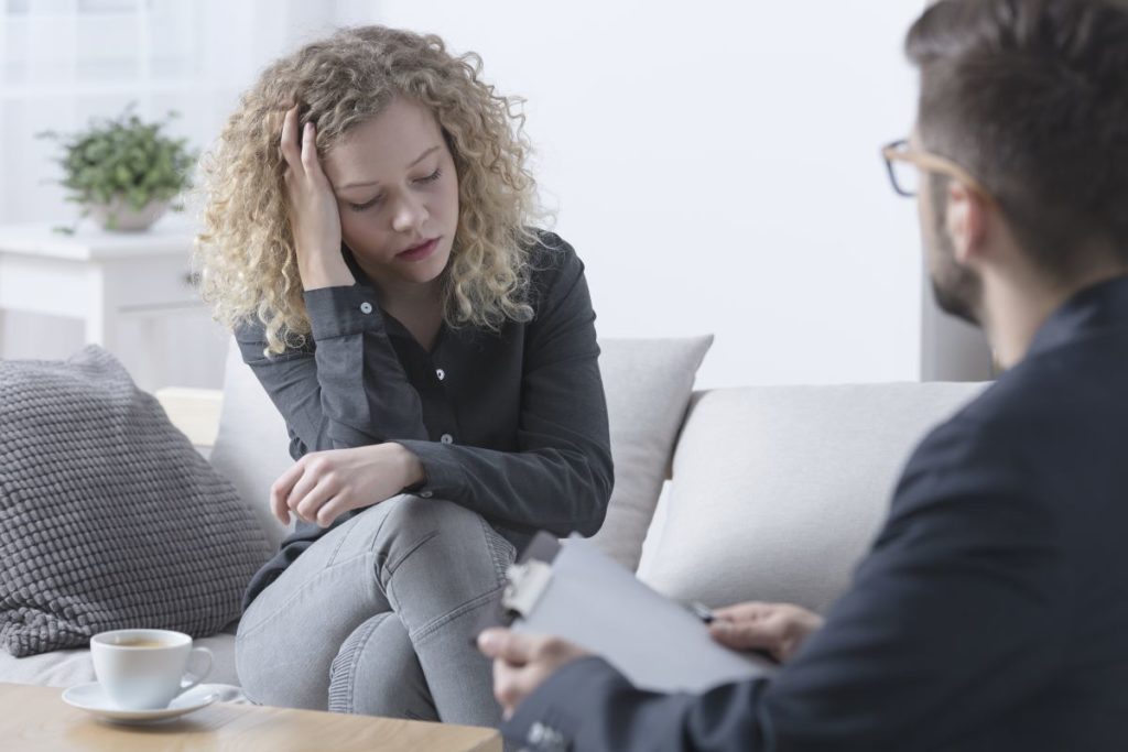 woman talking to mental health professional