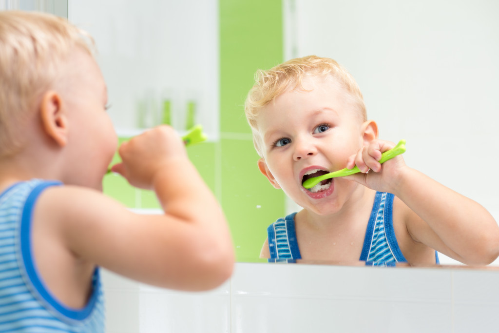 a children brushing teeth